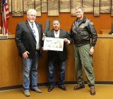 Kings Board Members Doug Verboon (left) and Richard Valle (center) welcome NAS Lemoore Capt. Douglas Peterson. 